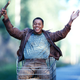 We have no idea why Cuba Gooding Jr. is riding in a shopping cart in this still from the film Radio, and fear that learning the answer would involve watching Radio